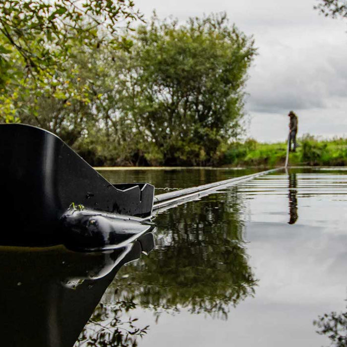 man carp fishing in lake